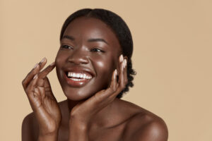 Beauty,Face.,Smiling,Black,Woman,Touching,Healthy,Skin,Portrait.,Beautiful